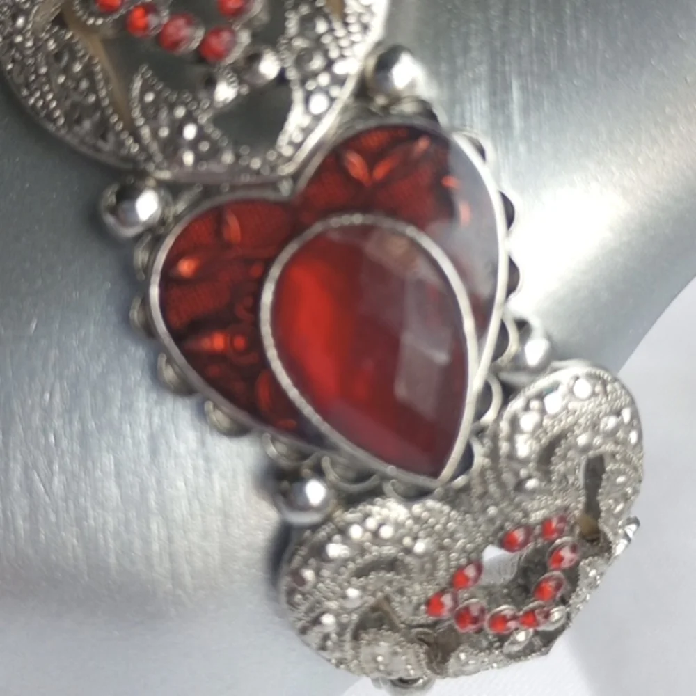 Red enamel and rhinestone encrusted silvertone heart-shaped stretchy bracelet